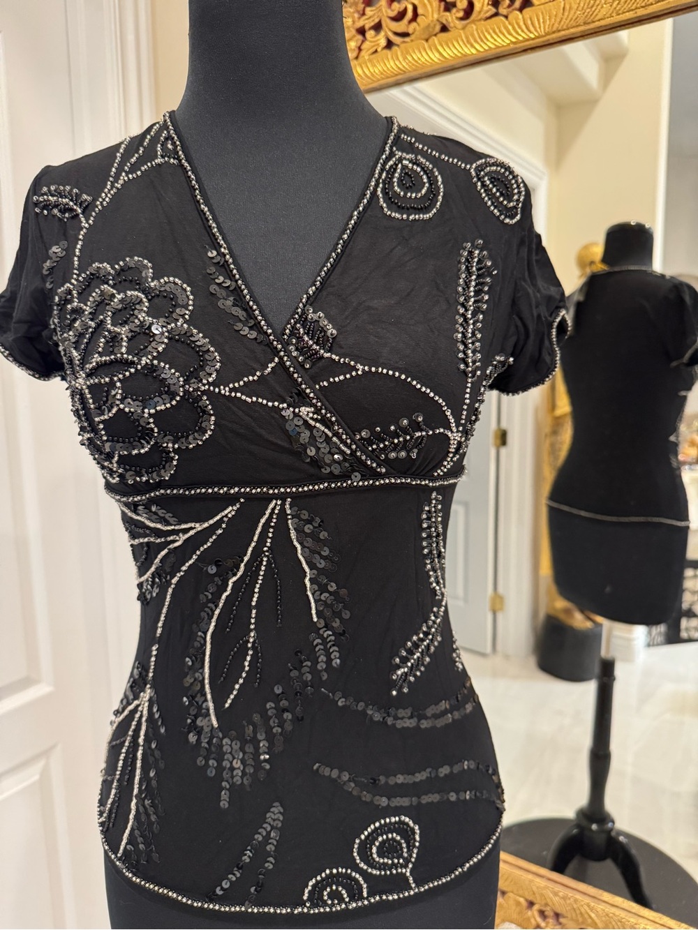 Hand beaded Embellished Black Sequin Wrap-Style Top. On stretch fabric.